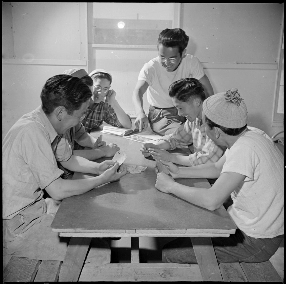 Topaz, Utah. Members of the fire department spend their leisure time by a friendly game of cards. - NARA - 537013