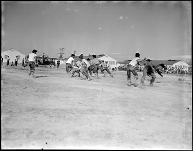 Topaz, Utah. Tough football, as practiced by these young residents at the Topaz center, develops in . . . - NARA - 538667