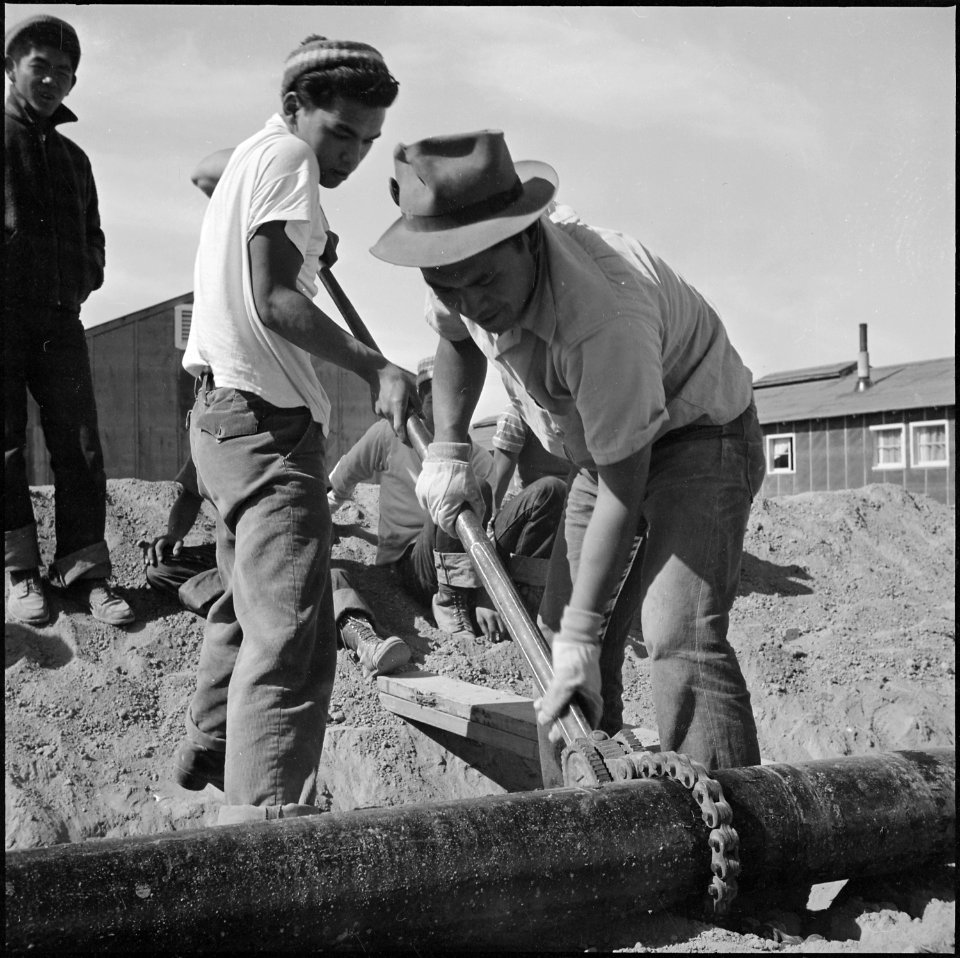 Topaz, Utah. Young volunteer workers, residents at the Topaz Relocation Center, completing the wate . . . - NARA - 538690