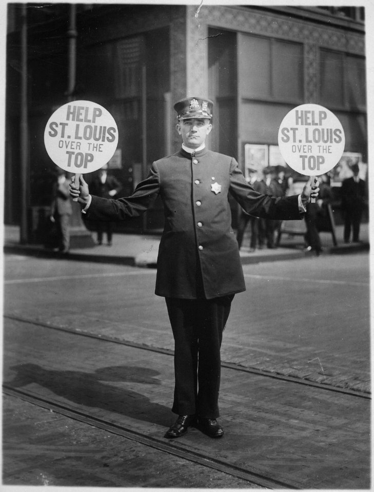 Traffic policeman using 4th Liberty Loan fans for signals. St. Louis, 1918. The Schreiber Company., 1917 - 1918 - NARA - 516487