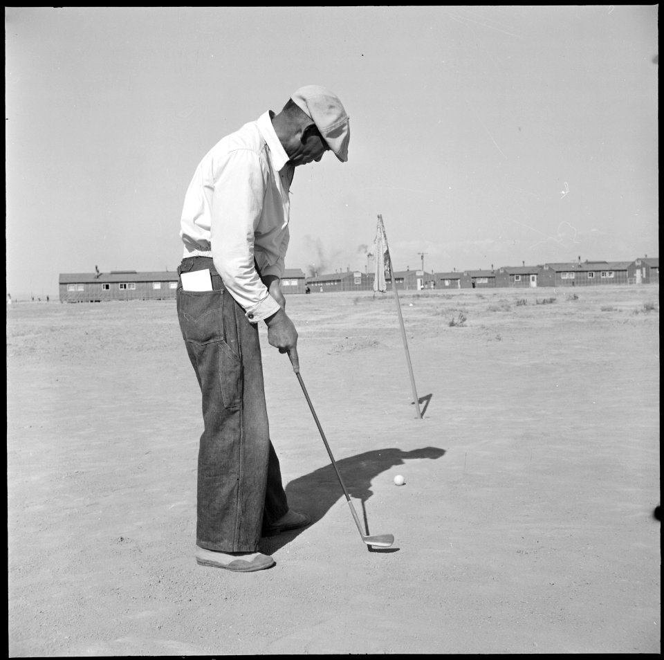 Topaz, Utah. This former California tournament runner-up keeps his golf form by first preparing a s . . . - NARA - 538717