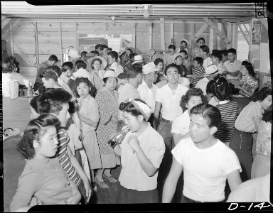 Tule Lake Relocation Center, Newell, California. A view showing part of the crowd at general store . . . - NARA - 538213 photo