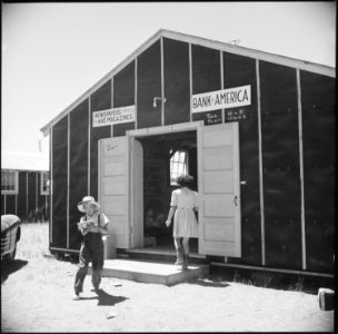 Tule Lake Relocation Center, Newell, California. A view of the bank and newsstand at this War Reloc . . . - NARA - 538244