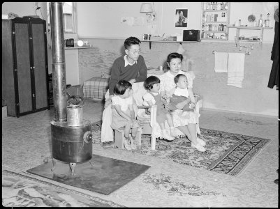Tule Lake Relocation Center, Newell, California. An evacuee family spends a quiet evening in their . . . - NARA - 538443