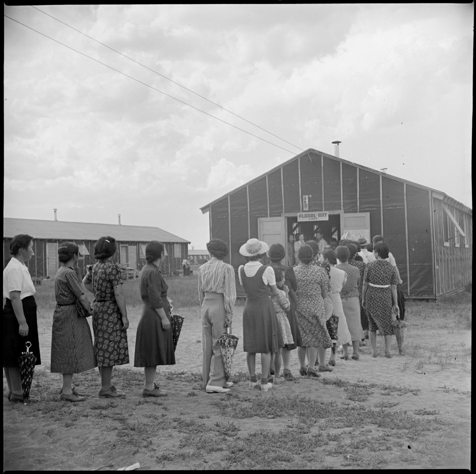 Tule Lake Relocation Center, Newell, California. Admiring lines of evacuees filed through a recreat . . . - NARA - 538396