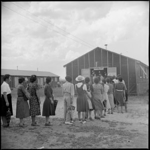 Tule Lake Relocation Center, Newell, California. Admiring lines of evacuees filed through a recreat . . . - NARA - 538396