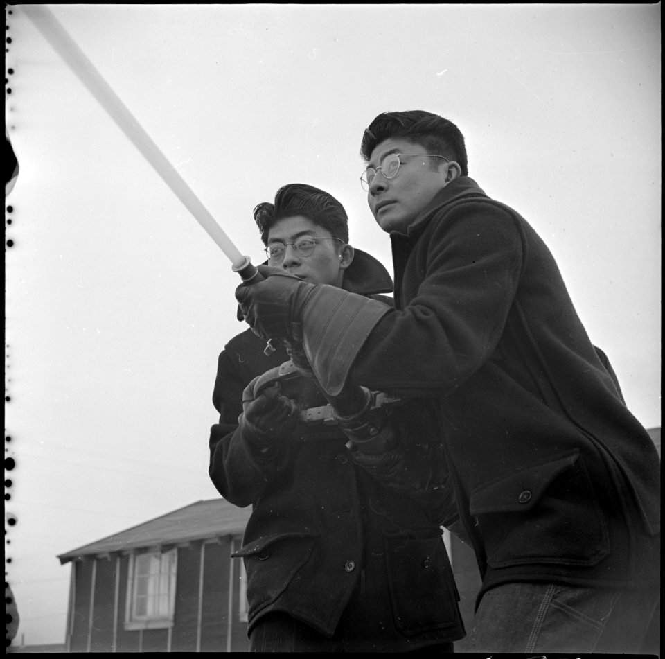 Tule Lake Relocation Center, Newell, California. Evacuee members of the fire department brave the . . . - NARA - 536740