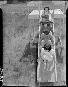Tule Lake Relocation Center, Newell, California. Five little nursery school children try out the sl . . . - NARA - 538232