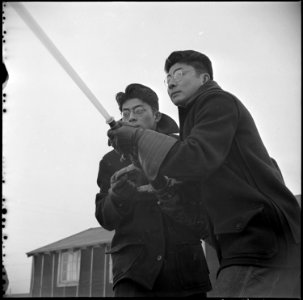 Tule Lake Relocation Center, Newell, California. Evacuee members of the fire department brave the . . . - NARA - 536740