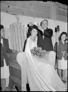 Tule Lake Relocation Center, Newell, California. Labor Day queen eats an ice cream cone and winks a . . . - NARA - 538469