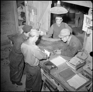 Tule Lake Relocation Center, Newell, California. Mechanics check parts and tools from the tool room . . . - NARA - 536733