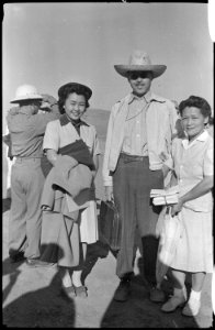 Tule Lake Relocation Center, Newell, California. Mrs. Ohmura and Father Dai bid goodbye to Mae Ohmu . . . - NARA - 539418
