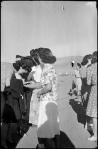 Tule Lake Relocation Center, Newell, California. Newest profession - evacuees get autograph of Sac . . . - NARA - 539415