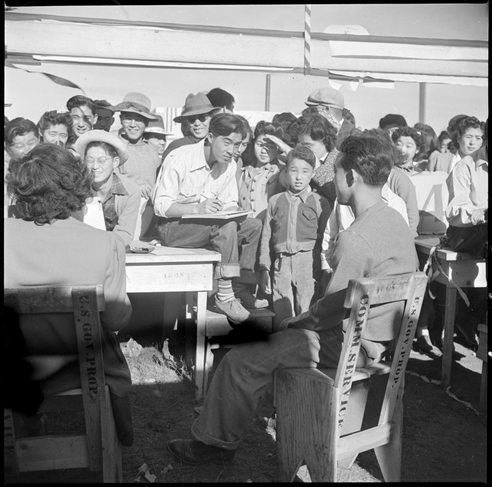 Tule Lake Relocation Center, Newell, California. Harvest Day Festival. An artist sketches one of t . . . - NARA - 536343