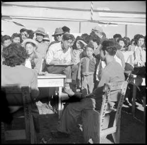 Tule Lake Relocation Center, Newell, California. Harvest Day Festival. An artist sketches one of t . . . - NARA - 536343