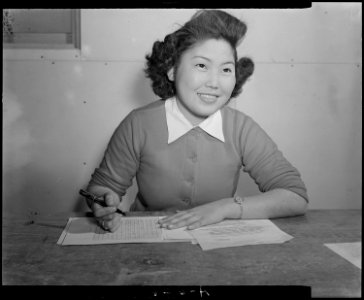 Tule Lake Relocation Center, Newell, California. Mary Oshiro of the Tulean Dispatch, Staff, center . . . - NARA - 536512