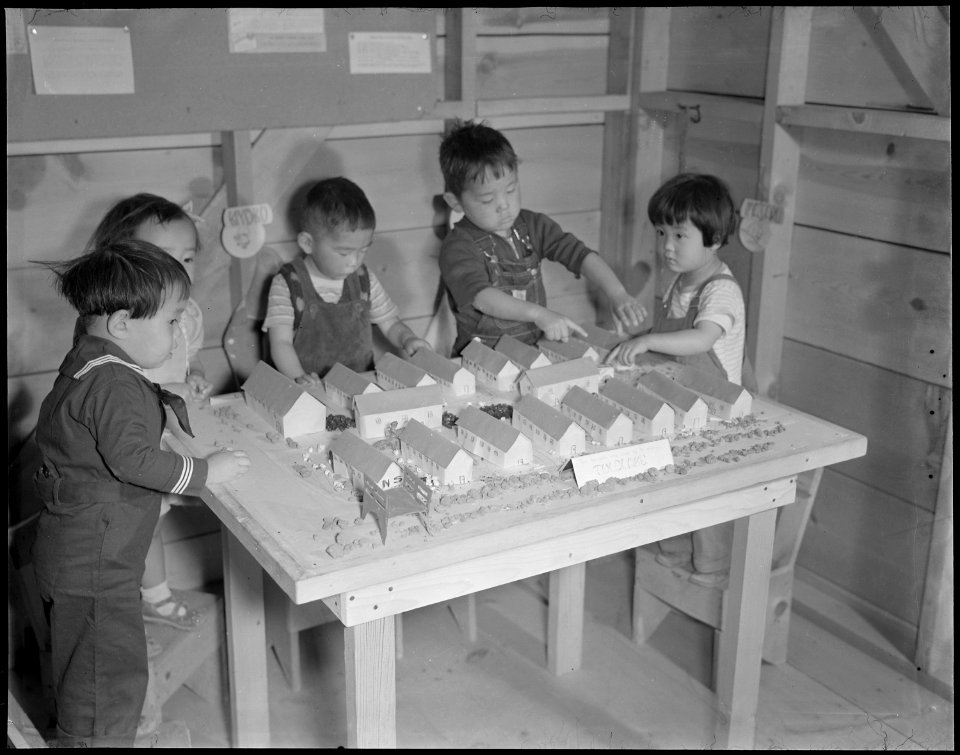 Tule Lake Relocation Center, Newell, California. Nursery school children with model barracks. - NARA - 536507