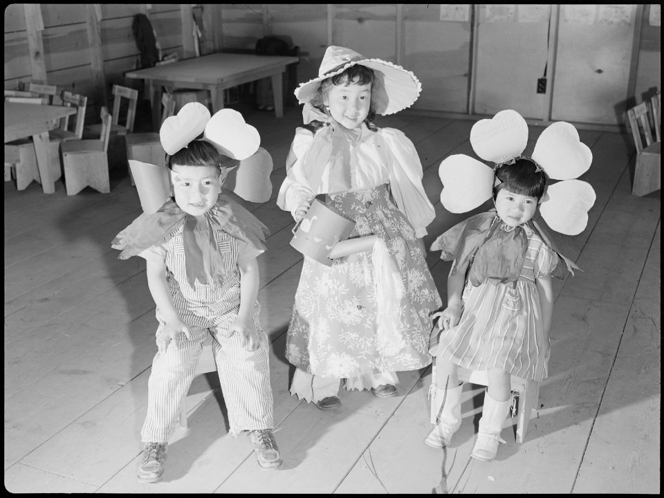 Tule Lake Relocation Center, Newell, California. Nursery school children pause for refreshments of . . . - NARA - 538344