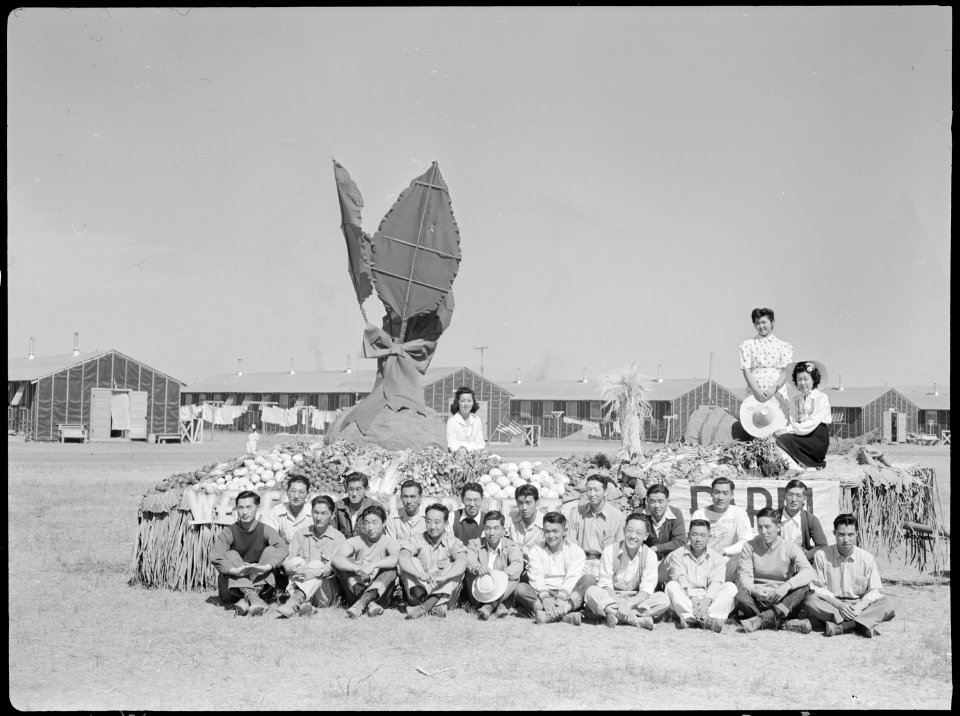 Tule Lake Relocation Center, Newell, California. Farm foremen are proudly posed in front of the pri . . . - NARA - 538416