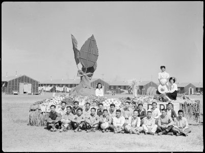 Tule Lake Relocation Center, Newell, California. Farm foremen are proudly posed in front of the pri . . . - NARA - 538416