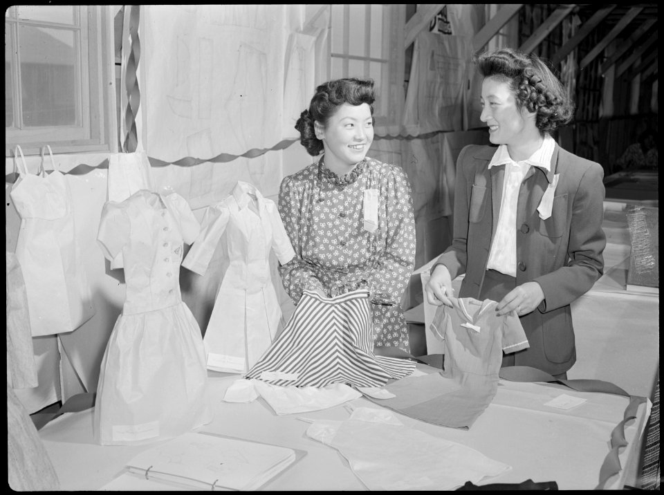 Tule Lake Relocation Center, Newell, California. These attractive young evacuees show the garments . . . - NARA - 538401