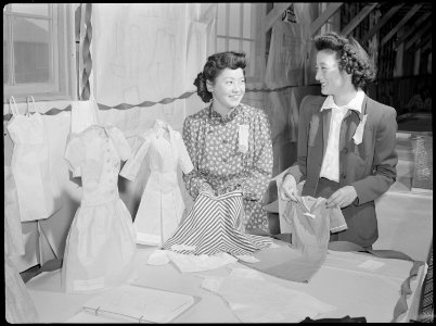 Tule Lake Relocation Center, Newell, California. These attractive young evacuees show the garments . . . - NARA - 538401