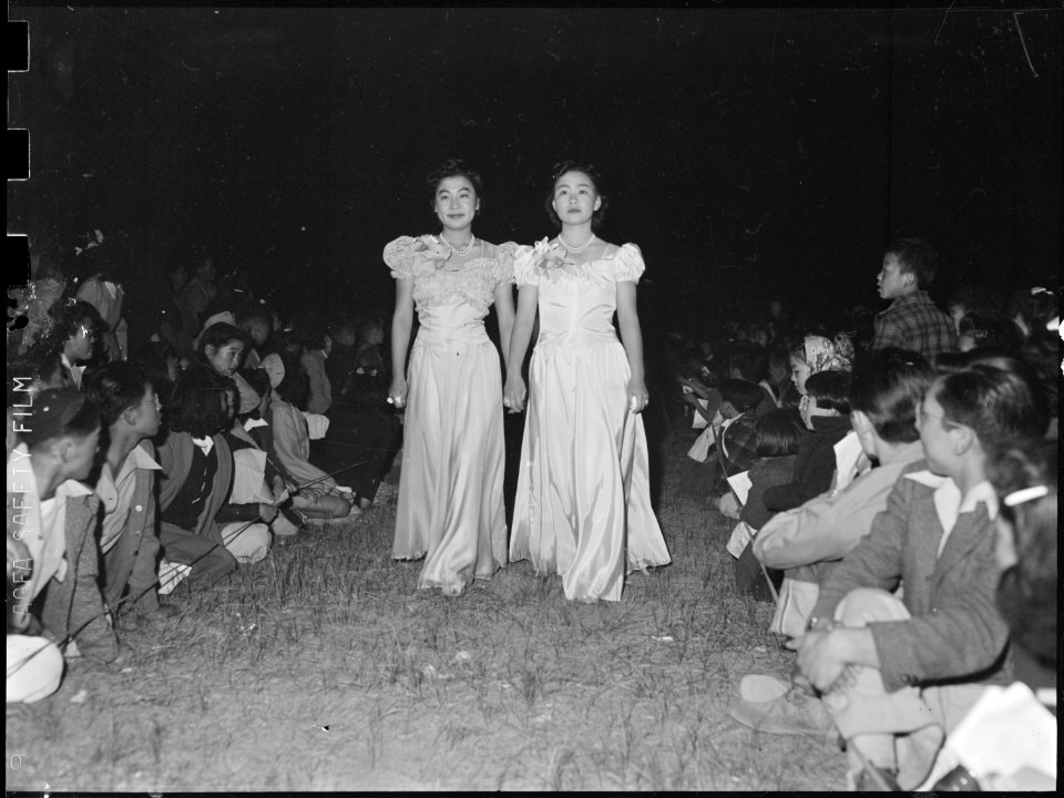 Tule Lake Relocation Center, Newell, California. Two of the labr day queen's attendants march down . . . - NARA - 538467