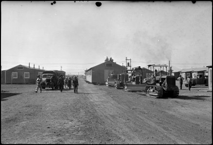 Tule Lake Segregation Center, Newell, California. Moving a 100-foot, 32-ton barrack office building . . . - NARA - 539585