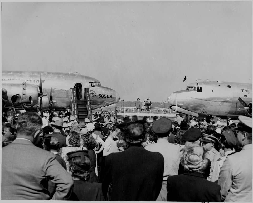 Two airplanes and a crowd assembled for the christening by Bess Truman of the airplanes. - NARA - 199105 photo