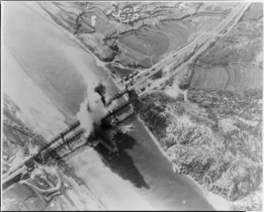 Two Probables. These railroad bridges cross Kum River about 10 miles north of Taejon. On near bridge, left approach... - NARA - 542200 photo