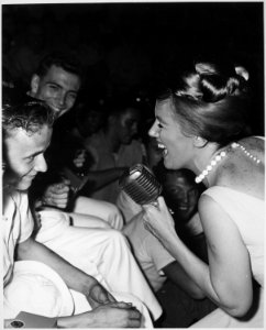 Twenty-one year old James R. Gould is the envy of 3,000 crewmembers as television actress Kathleen Nolan singles him out - NARA - 541854