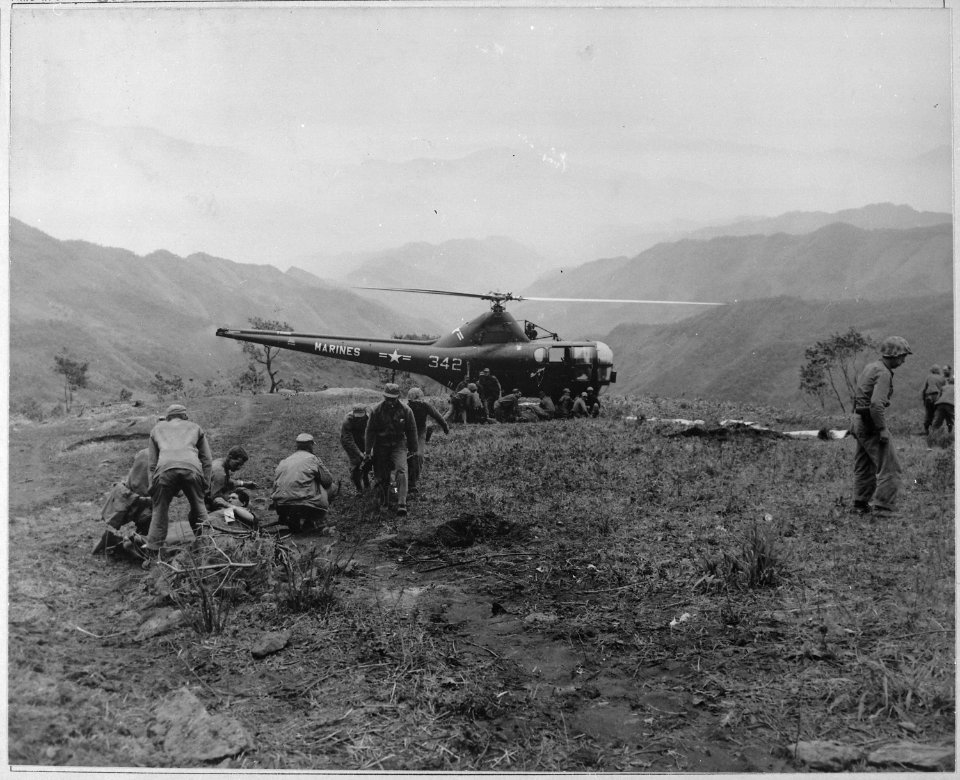 U.S. Marines wounded at Kari San Mountain are evacuated via helicopter and flown to hospital in rear areas for... - NARA - 520793
