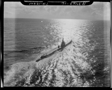 U.S. Pacific submarine on war patrol. Pacific sunlight silvers the sea. - NARA - 520690