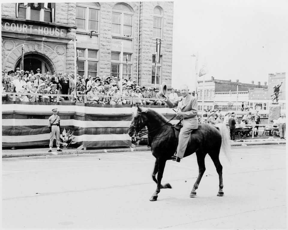Unidentified man on horseback passing in front of the reviewing platform on which President Harry S. Truman is... - NARA - 199898