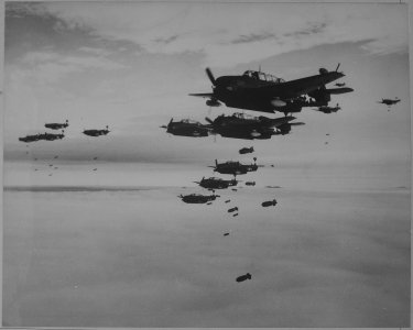 USS ESSEX based TBMs and SB2Cs dropping bombs on Hakodate, Japan. - NARA - 520989