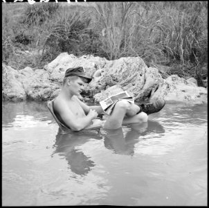 Vietnam....Corporal Bob McDonald, a rifleman with Headquarters, 9th Marine Regiment, takes time out to relax. For... - NARA - 532461