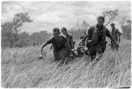 Vietnam. Medical Evacuation. Marines of Company E, 2nd Battalion, 9th Marines, while under heavy firefight with NVAs... - NARA - 532448