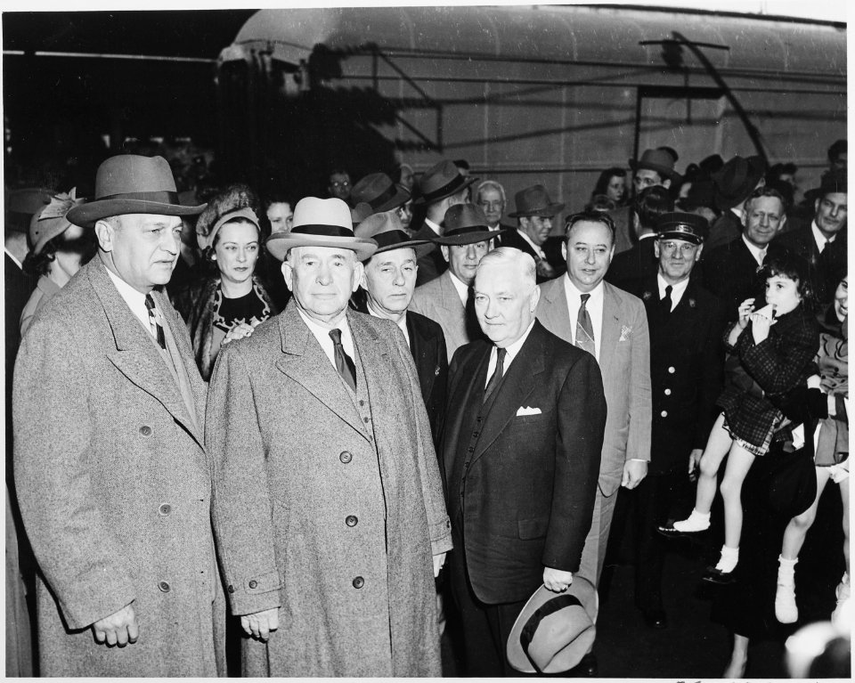 Vice President-elect Alben W. Barkley standing with several unidentified people. Barkley had just returned to... - NARA - 199941