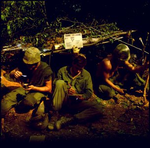 Vietnam....Home is where you dig was the sign over the fighting bunker of Private First Class Edward, Private First... - NARA - 532482 photo