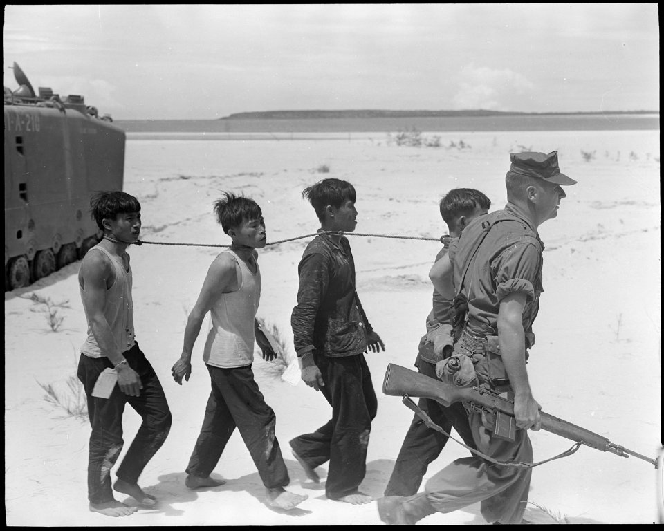 Vietnam....Known Viet Cong prisoners are being led to a helicopter landing zone for evacuation to the regimental... - NARA - 532428