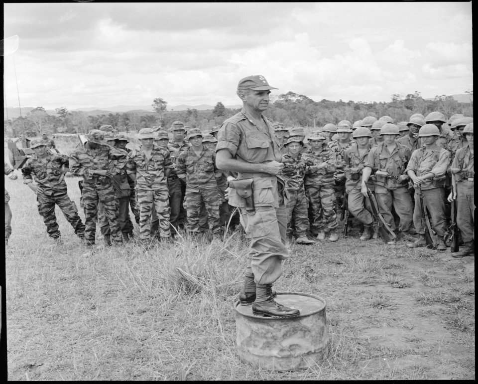 Vietnam....Brigadier General Willard Pearson of the 101st Airborne Brigade briefs troops on the forthcoming Operation... - NARA - 531445