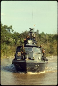 Vietnam....U.S. Navy inshore patrol craft PCF-38 of Coastal Division 11 patrols the Cai Ngay Canal. - NARA - 558516