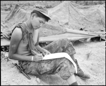 Vietnam....Private First Class Joseph Big Medicine Jr., a Cheyenne Indian, writes a letter to his family in the... - NARA - 532485