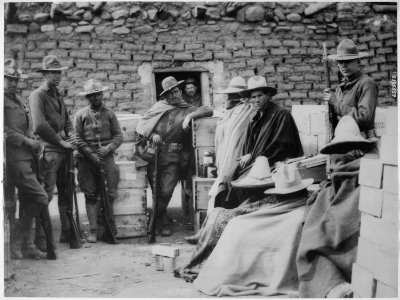 Villa bandits who raided Columbus, New Mexico, caught by American soldiers in the mountains of Mexico and held, in camp - NARA - 533443 photo