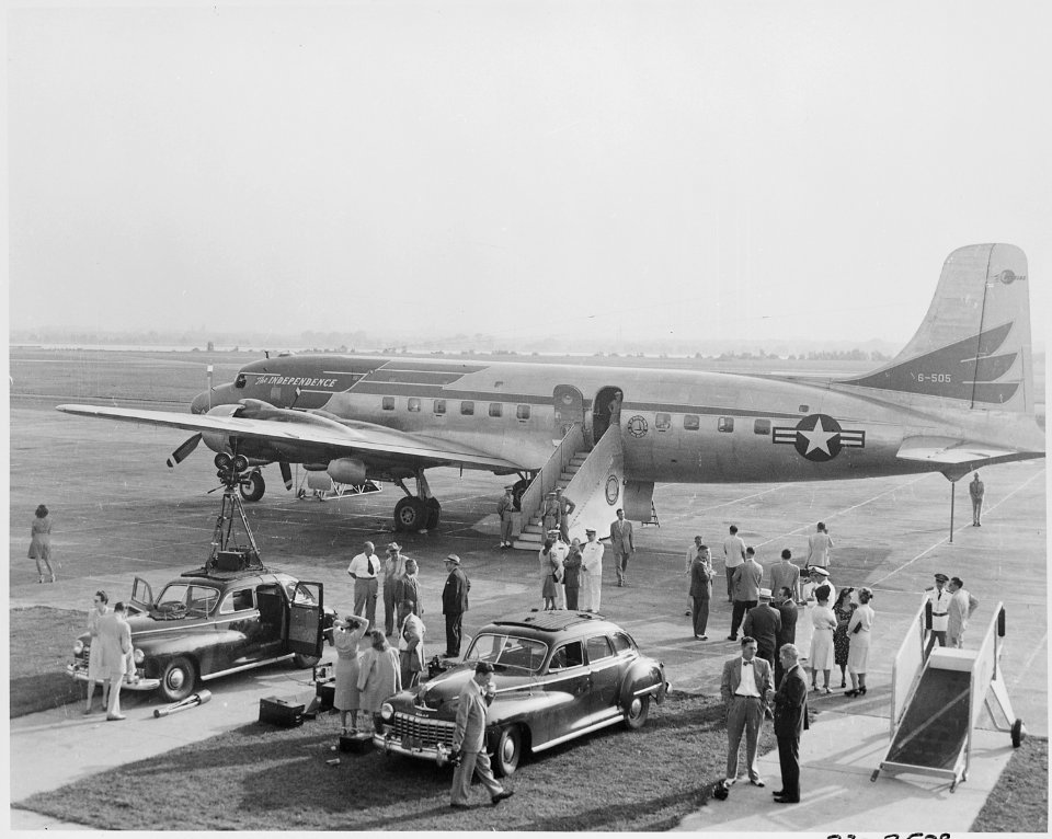 View of the Independence, the presidential airplane. President Truman and his party (distance view) are below... - NARA - 199692