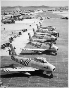View of F-86 airplanes on the flight line getting ready for combat. Air Force. - NARA - 541958 photo