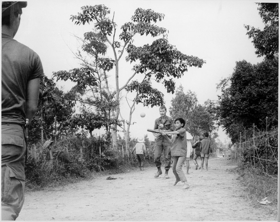 Vietnam....Members of the 3rd Battalion, 187th Infantry, 101st Airborne Division (Airmobile), join the children of Ap... - NARA - 531465 photo