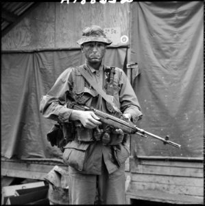 Vietnam....Sergeant David E. Weimer prepares to go into the field with Company A, Reconnaissance Battalion. Weimer is... - NARA - 532446 photo