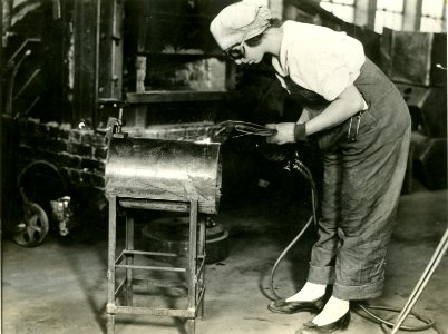 Woman welding 1919 photo
