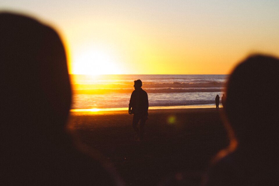 Beach walking sunset